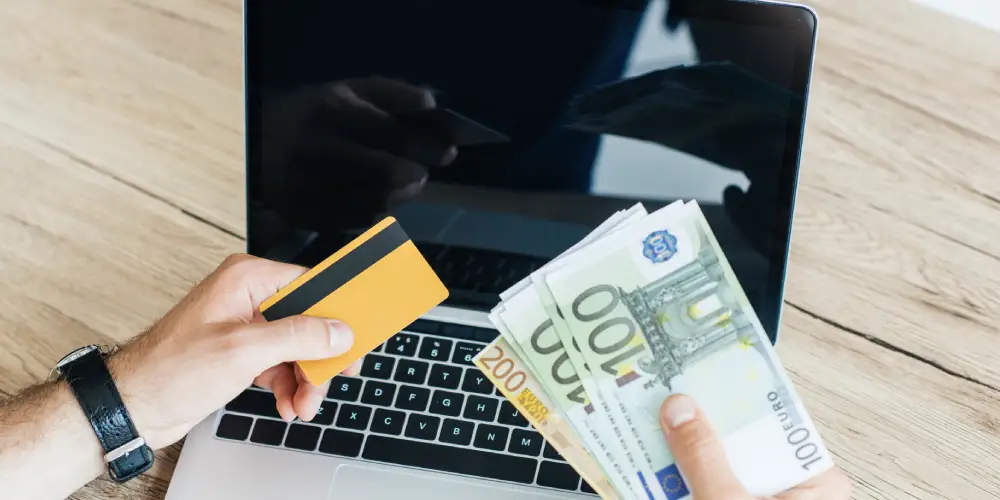 laptop, cash and a credit card