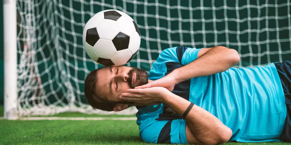 football player sleeping on the pitch